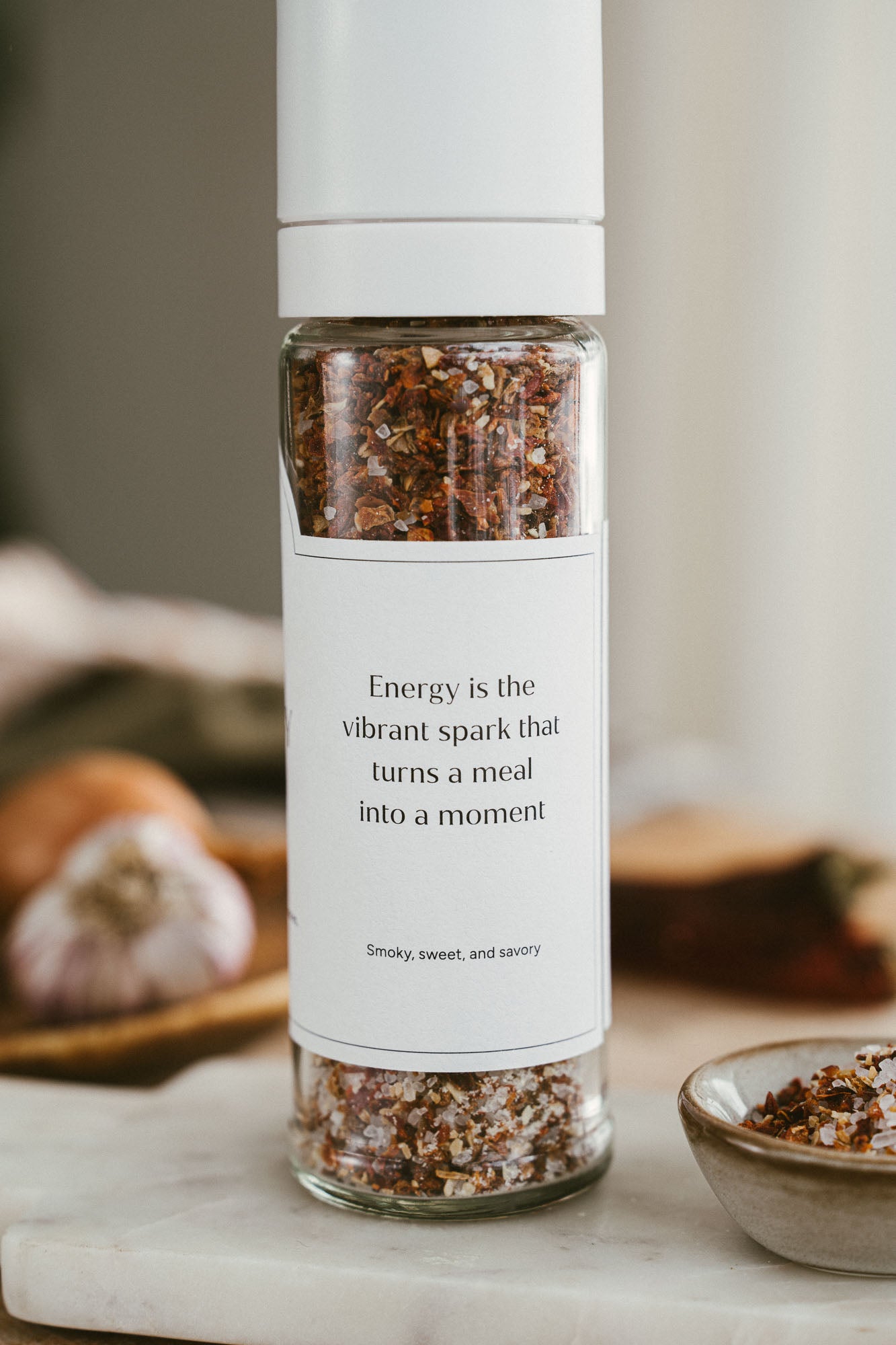 Spice grinder with a label on a kitchen counter